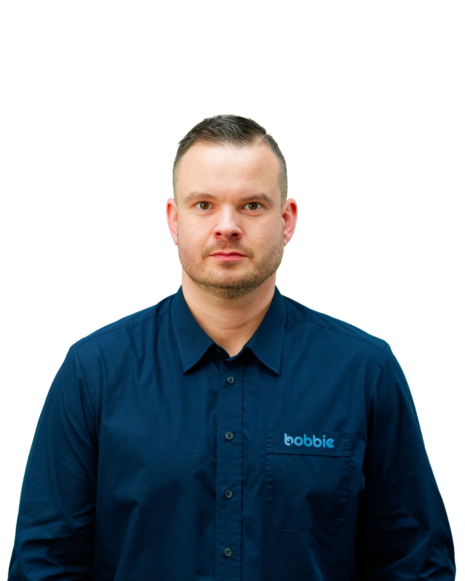 Portraitfoto des Ansprechpartners Thilo: Freundlich lächelnder Mann in dunkelblauem Hemd mit 